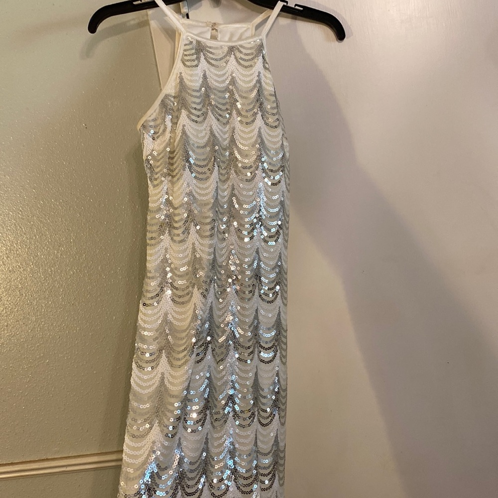 White and silver sparkly sequin dress. Sleeveless razorback type dress. (Size 7)